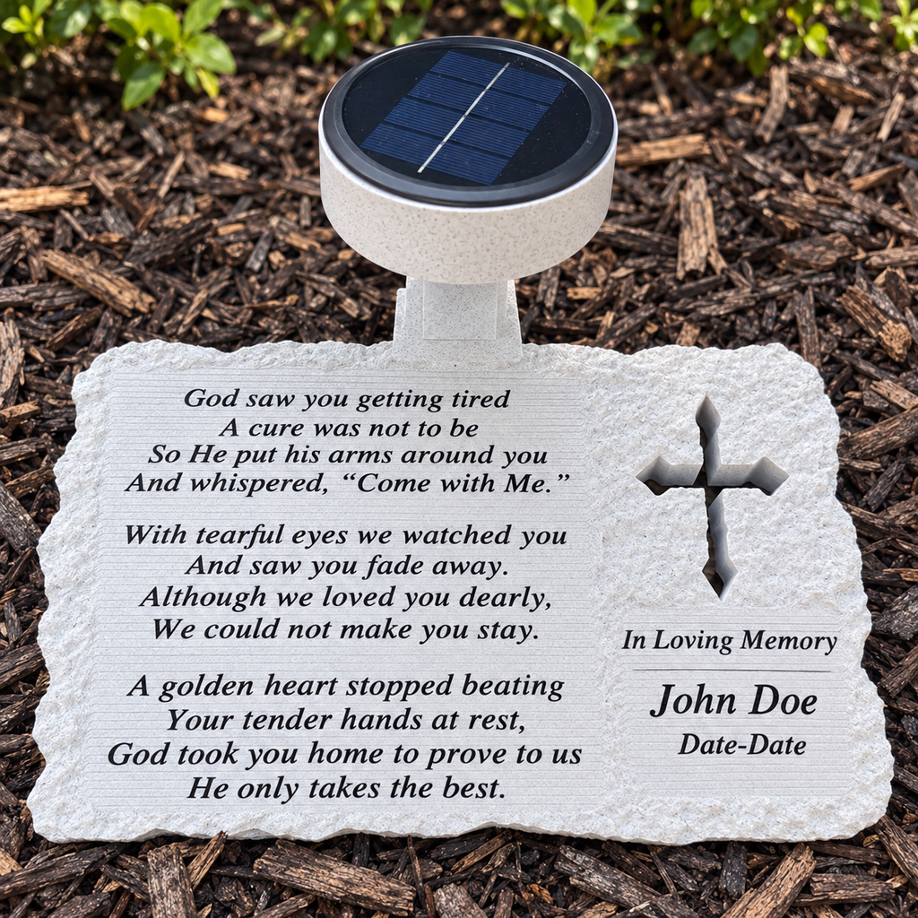Cross design solar memorial in a garden with God Saw You Getting Tired remembrance poem and John Doe example inscription