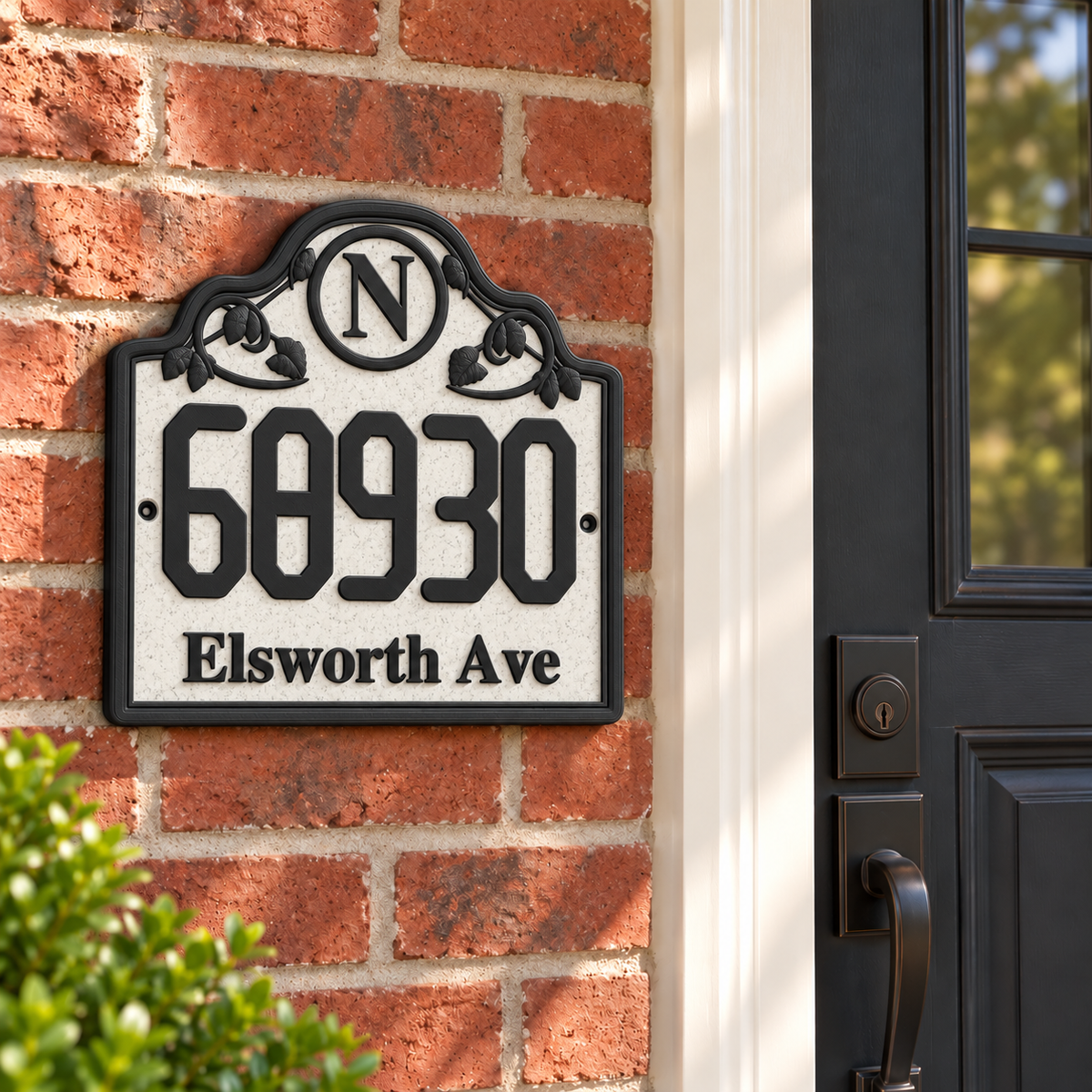 HSornate-mb marble and black personalized house sign mounted on a brick entryway