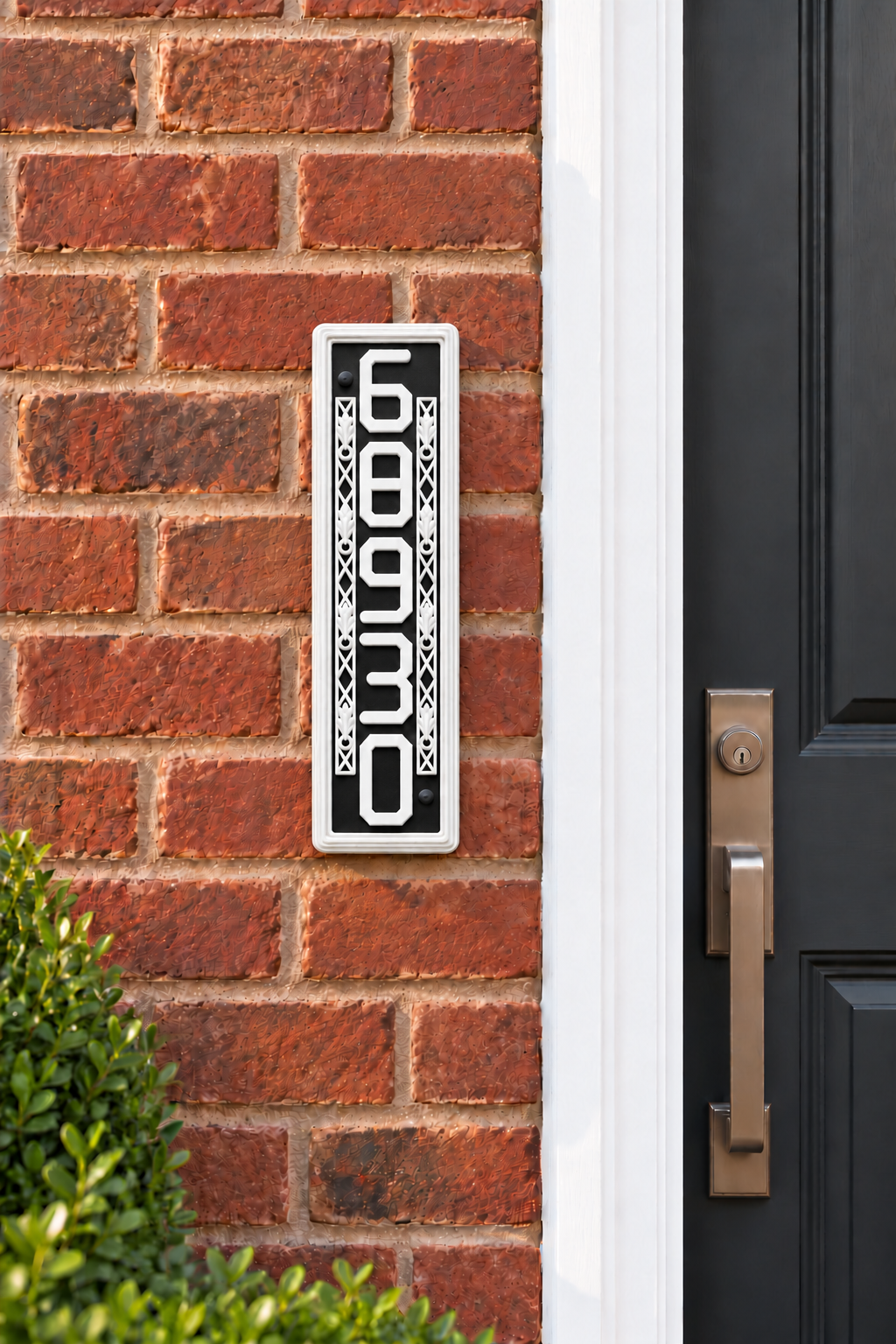 HSornatev-bw vertical black and white house and mailbox number sign, mounted beside a brick home entrance