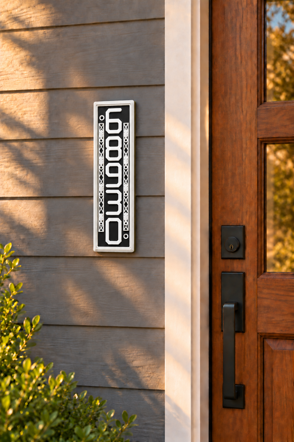 HSornatev-bw vertical black and white house and mailbox number sign, mounted on gray house siding