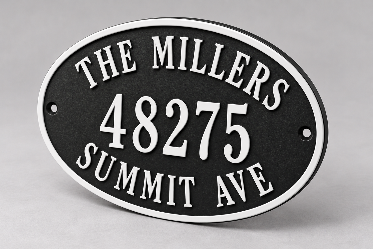 Personalized oval family name and address sign in black and white — angled detail view