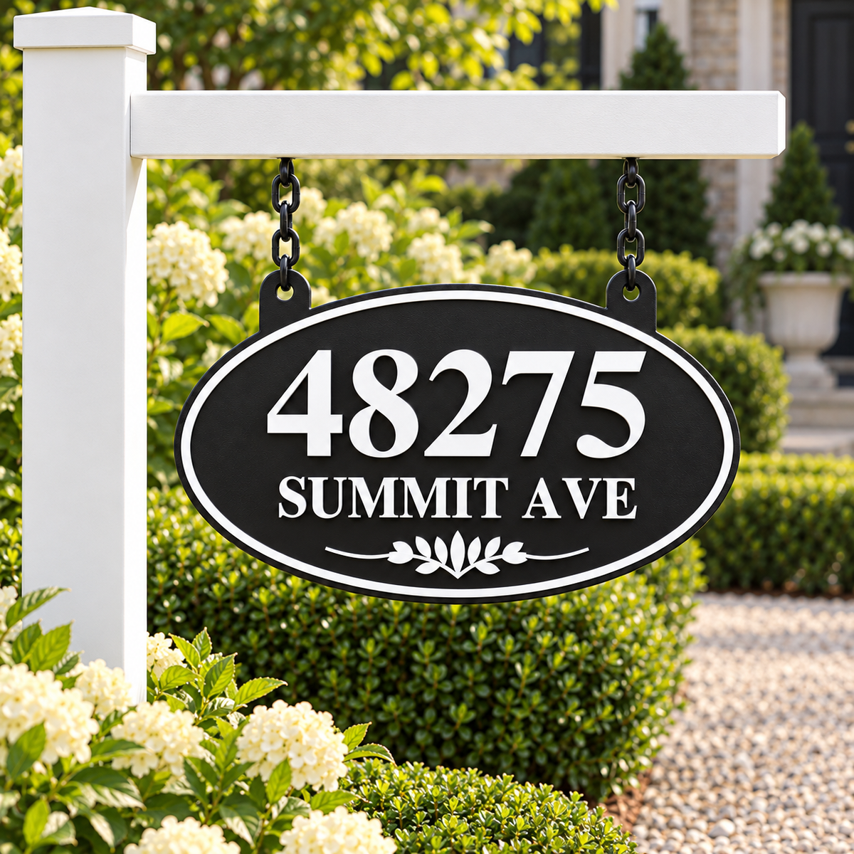 Black & White oval hanging address sign with 48275 Summit Ave, hanging from a white post arm