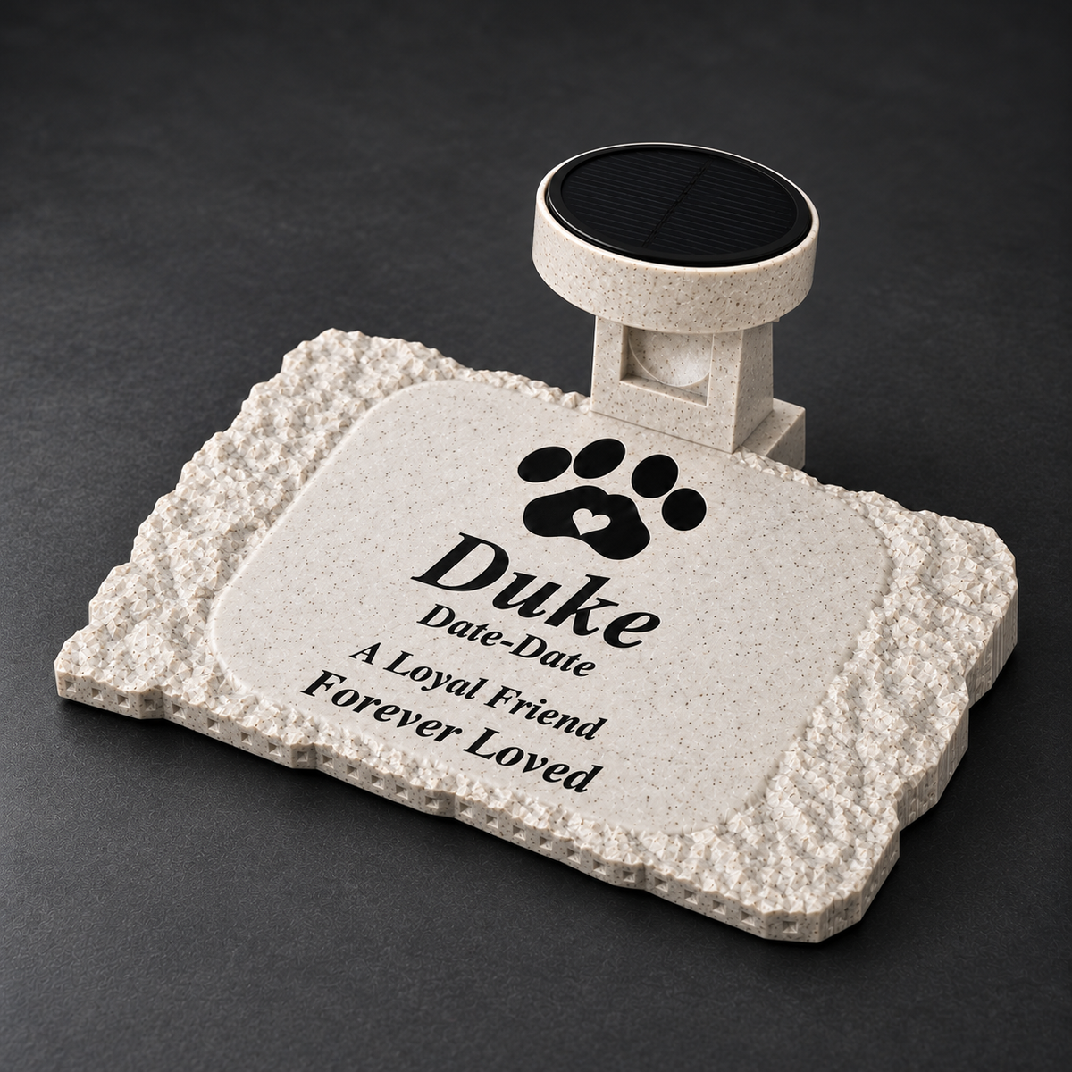 Angled studio view of the rough rectangular Duke pet memorial showing the textured border, shallow sloping body, and matching solar-light holder