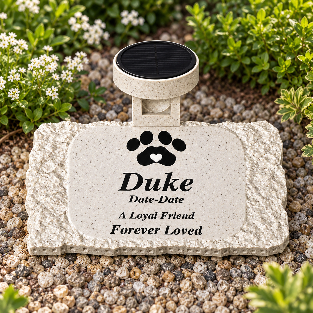 Rough rectangular personalized Duke pet memorial with solar light displayed in a garden during daylight