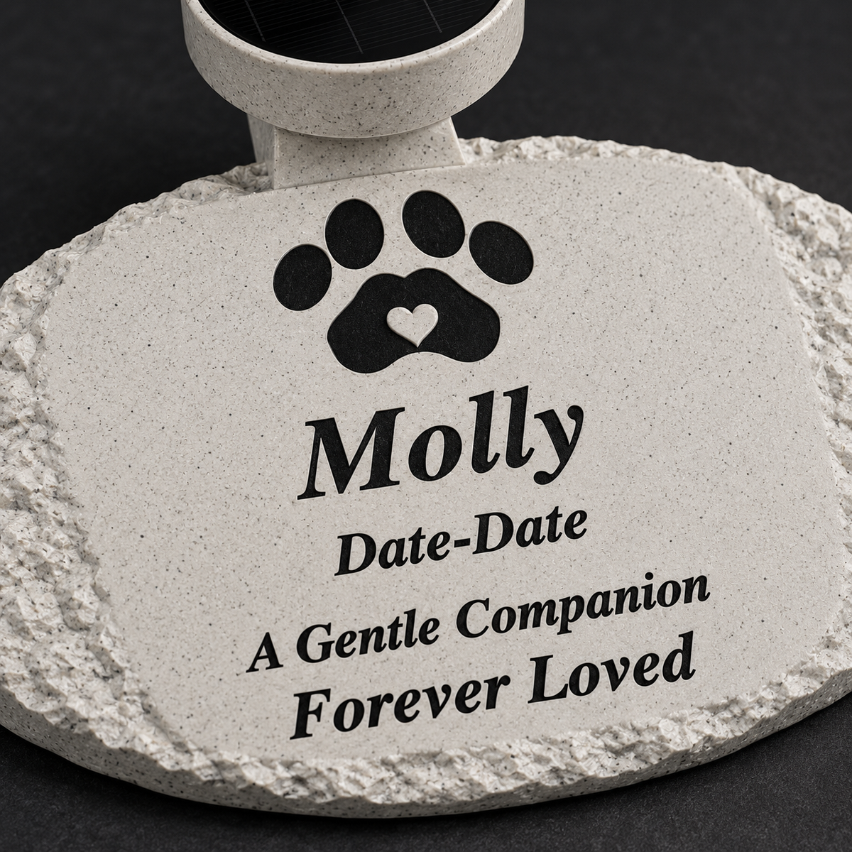 Close-up of black personalized lettering, rough oval edge, and paw with heart detail