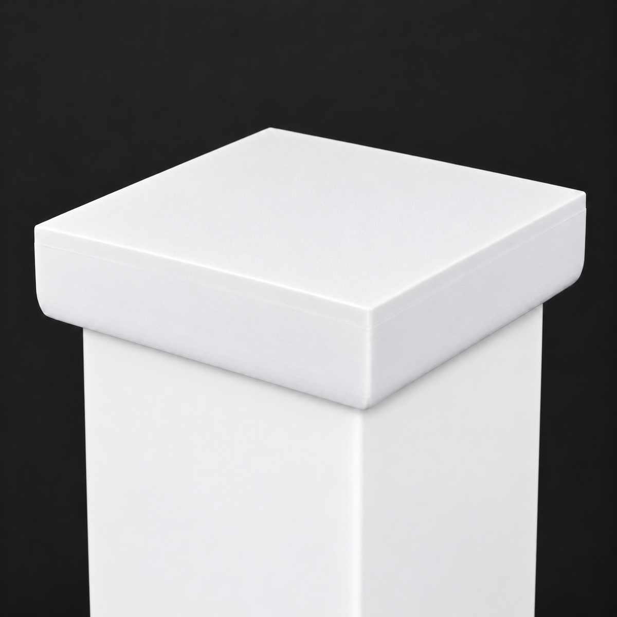 White plain post cap installed on a post, close-up view