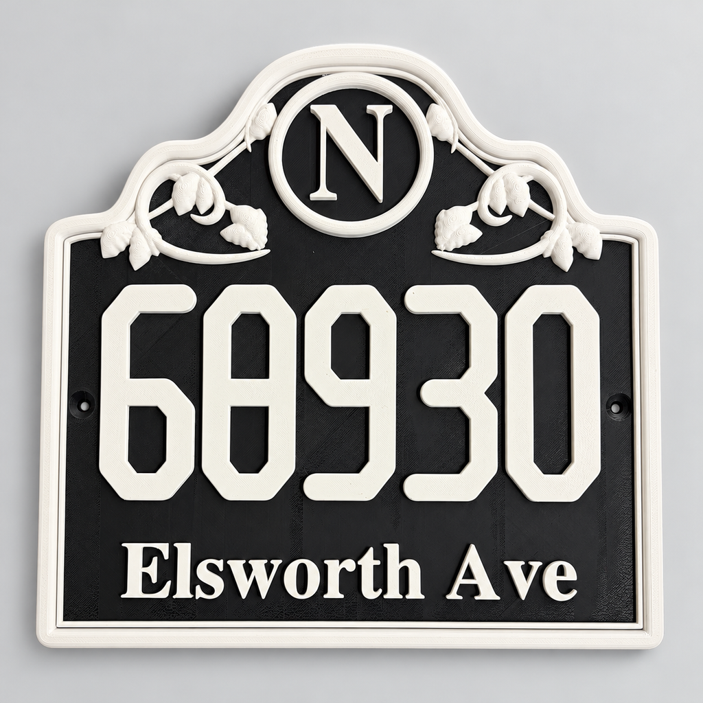 Black and white ornate monogram house number sign with raised address and scrollwork