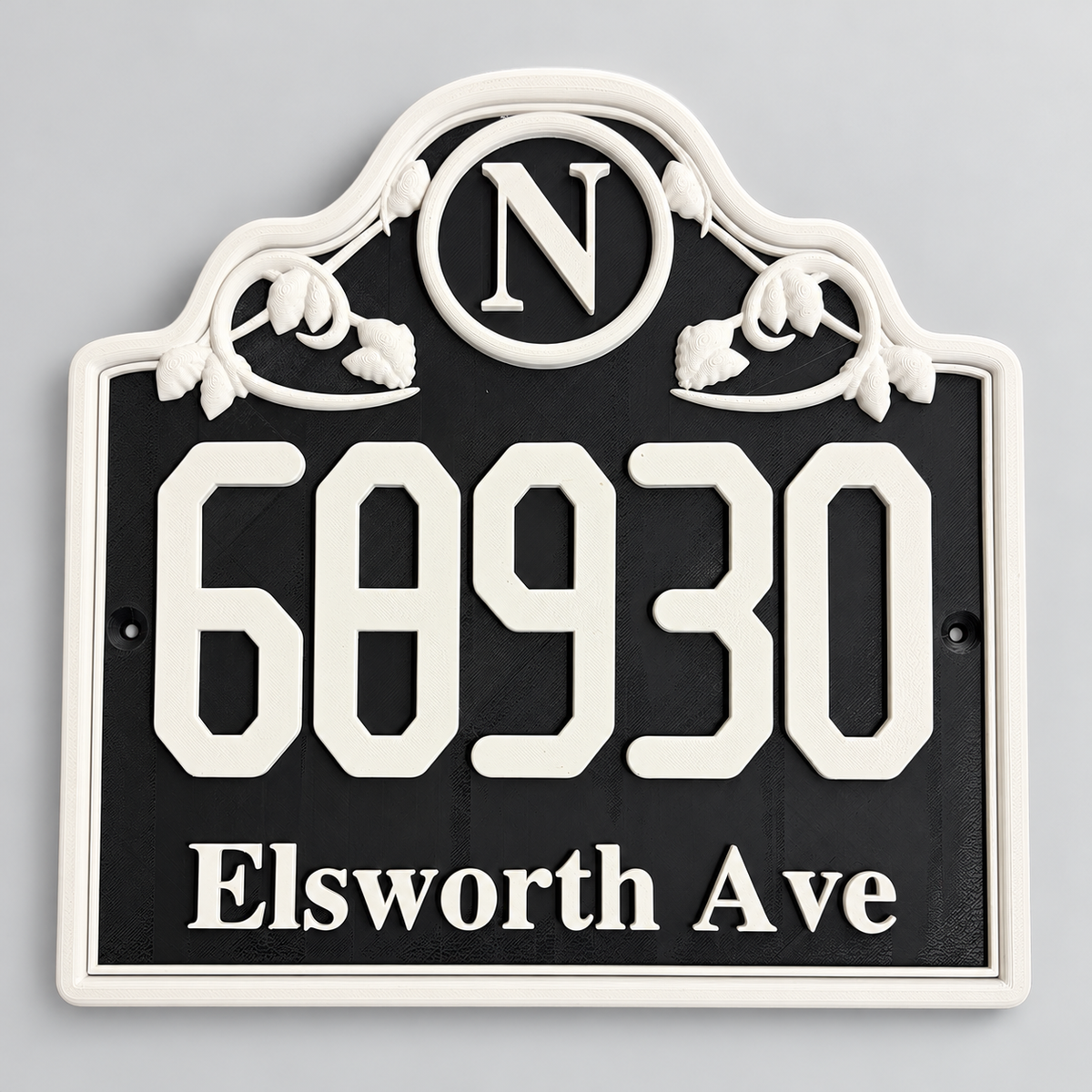 Black and white ornate monogram house number sign with raised address and scrollwork
